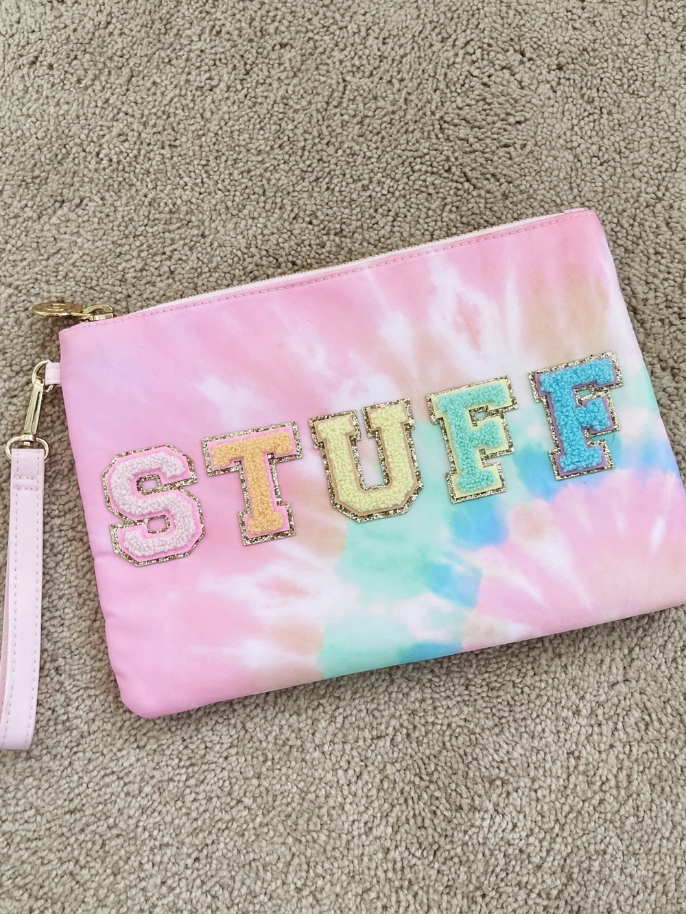 Stoney clover lane x target tie dye flat pouch with “STUFF” patches stuck on